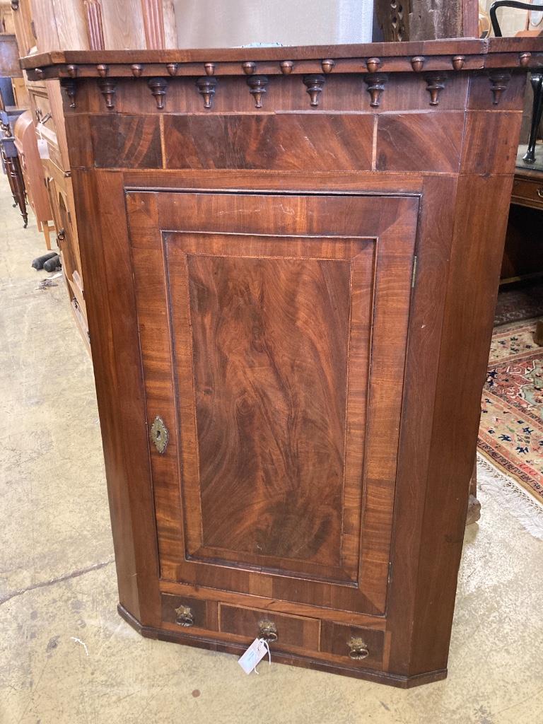 A George III mahogany hanging corner cupboard, width 84cm, depth 43cm, height 121cm